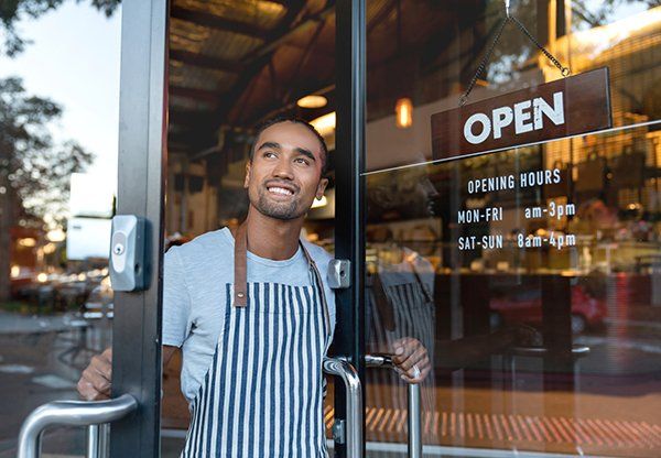 Business owner at the shop door — Grapevine, TX — Silvas Law, PC