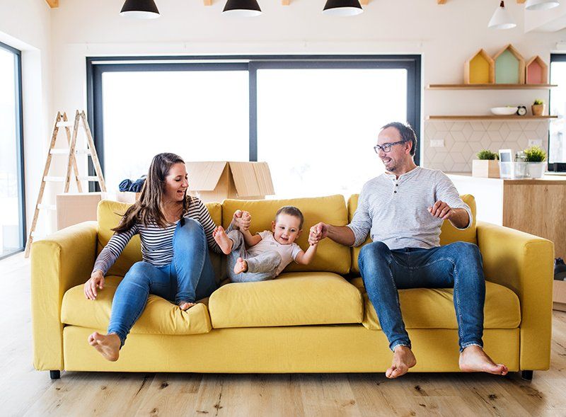 Happy family on a sofa — Grapevine, TX — Silvas Law, PC